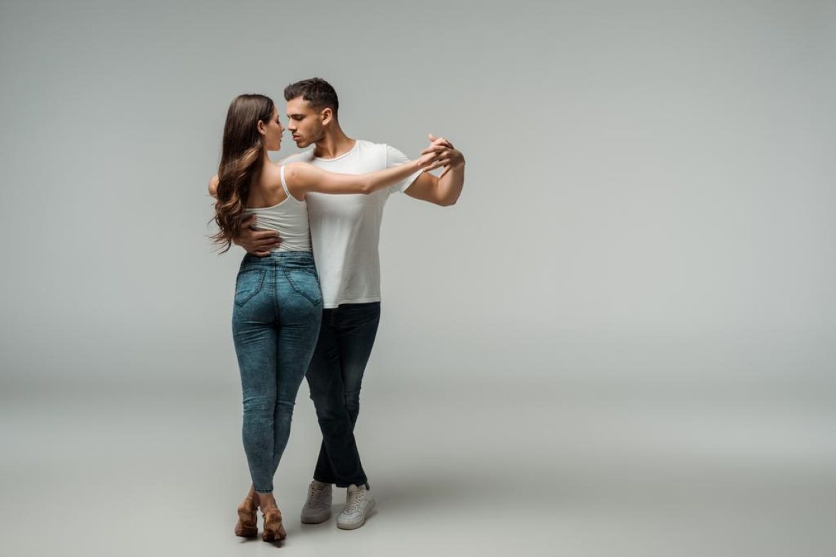 stock-photo-dancers-denim-jeans-dancing-bachata-grey-background (1)