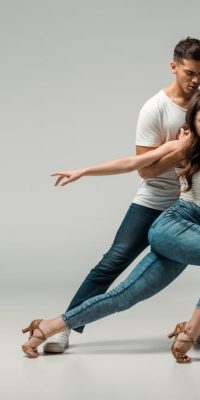 stock-photo-dancers-denim-jeans-dancing-bachata-grey-background