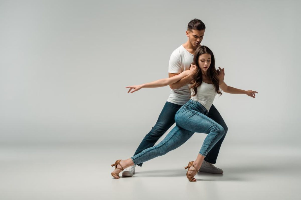 stock-photo-dancers-denim-jeans-dancing-bachata-grey-background