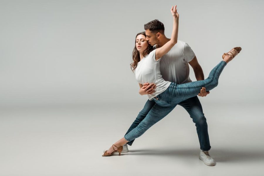 stock-photo-dancers-shirts-jeans-dancing-bachata-grey-background